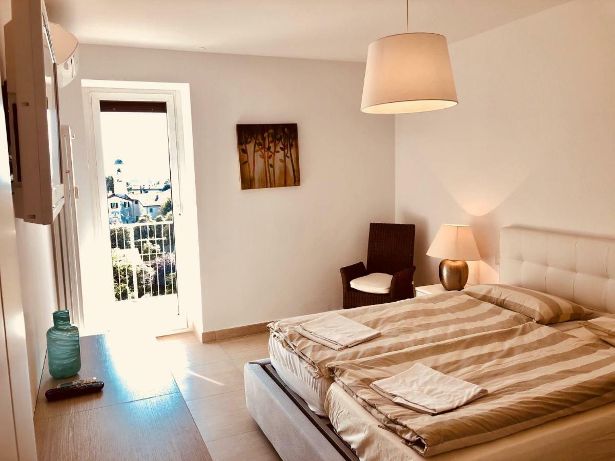 Ferienwohnung Attico Palazzo Di Vetro Luino Exterior foto